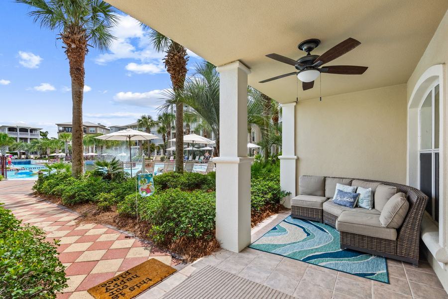 Covered patio seating with a view toward the lagoon pool
