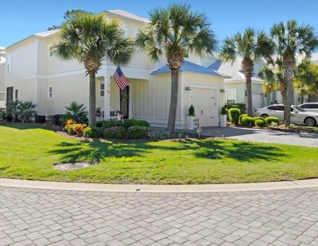 94 Lakeland Drive, a two-story home with palms on a corner lot